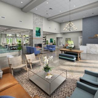 A contemporary lounge area featuring stylish furniture and elegant decor.