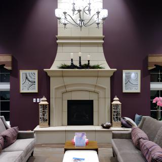 A stylish living room with a central fireplace and elegant decor.
