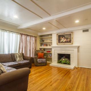 A cozy living room with a fireplace and comfortable seating.