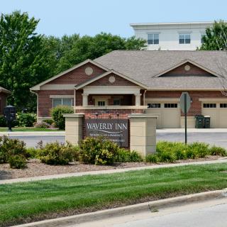 A suburban residential building with well-maintained landscaping.