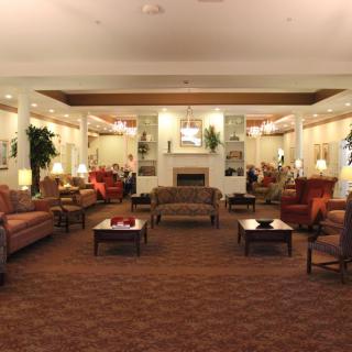 A cozy lobby with comfortable seating and warm lighting.