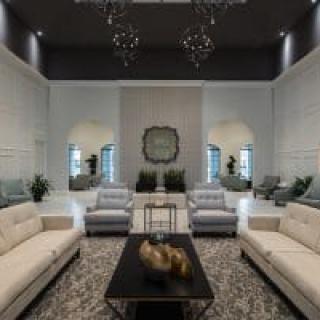 A luxurious and elegantly designed modern living room featuring plush sofas and stylish decor.