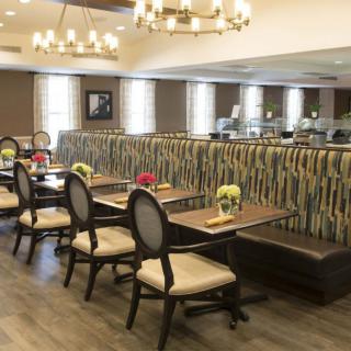 A well-decorated dining area with elegant seating and ambient lighting.