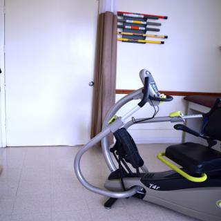A piece of exercise equipment set up in a room, ideal for fitness training or rehabilitation.