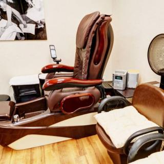 A comfortable pedicure chair setup in a spa or salon.