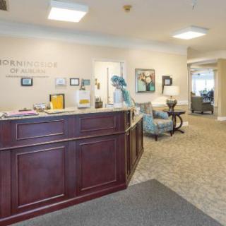 A welcoming office reception area with a desk and comfortable seating.