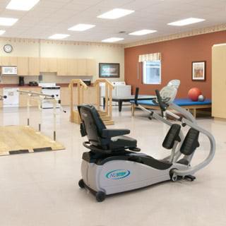 A well-equipped rehabilitation room with exercise machines and therapy facilities.