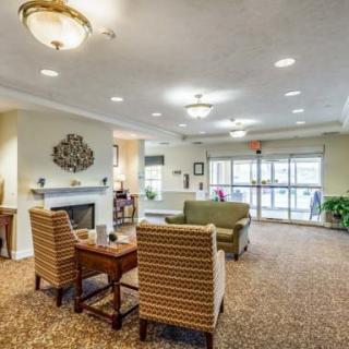 A cozy living room with comfortable seating and warm lighting.