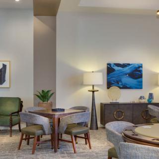 A modern living room with stylish furniture and artwork.