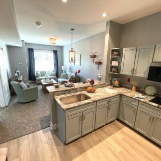 A modern open-concept kitchen and living room with stylish decor.