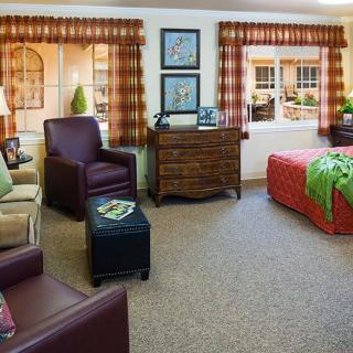 A cozy and well-decorated living space with comfortable seating and natural light.