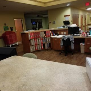 Interior view of a hospital reception area and workstation.