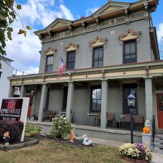 A beautifully preserved historic building featuring elegant architecture and seasonal decorations.