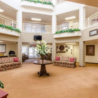 A spacious hotel lobby with comfortable seating and elegant decor.