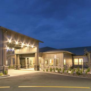 A well-lit building entrance at night.