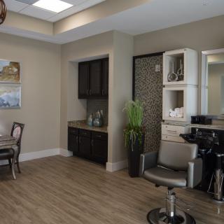 A modern salon interior featuring stylish furnishings and a relaxing atmosphere.