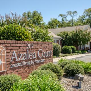 Entrance sign for Azalea Court, a senior living community.