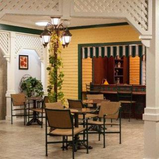 Cozy indoor patio seating with decorative elements and warm lighting.