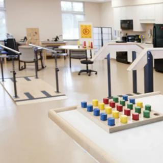 A physical therapy room equipped with various rehabilitation tools and exercise equipment.