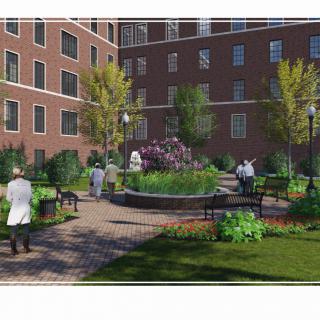 A landscaped courtyard with benches and people enjoying the greenery in an urban setting.