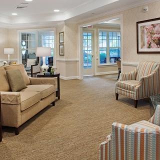 A cozy living room with comfortable seating and warm lighting.