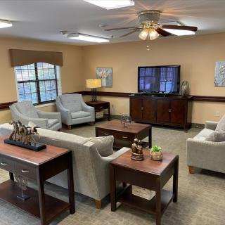 A cozy living room with comfortable seating and a television.