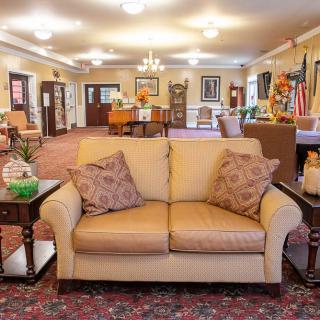 A warm and inviting living room with comfortable seating and elegant decor.