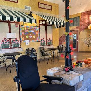 A cozy lobby area with decorative elements and seating arrangements, inviting a warm atmosphere.