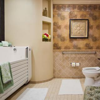 A well-decorated bathroom with a bathtub, decorative tiles, and stylish accessories.