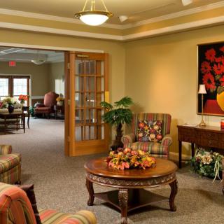 A cozy living room with elegant furniture and vibrant decorative elements.