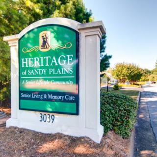 Entrance sign for Heritage of Sandy Plains senior living and memory care facility.