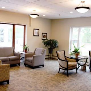 A cozy living room with comfortable seating and bright natural light.