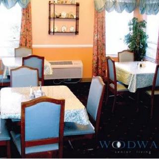 A cozy dining area in a restaurant with neatly arranged tables and chairs.