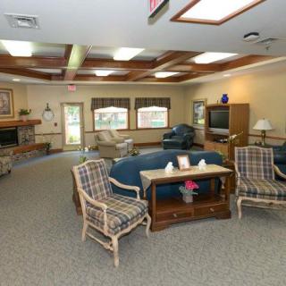 A cozy living room with comfortable seating and a television.