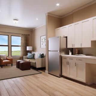 A cozy and modern apartment with an open kitchen and living room layout.