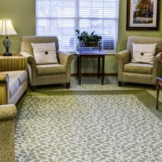 A cozy living room with comfortable seating and elegant decor.
