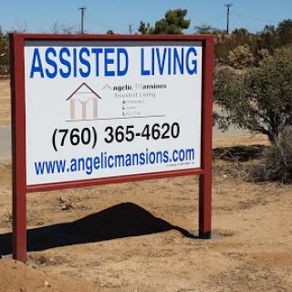 A sign for an assisted living facility providing contact information and a website.