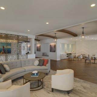 A modern living room with comfortable seating and stylish decor.