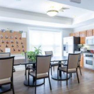 A modern kitchen and dining area with natural lighting.