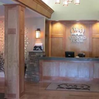 Hotel reception area with a welcoming front desk and elegant decor.