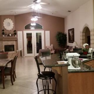 Spacious open-concept living area with a modern kitchen and dining setup.