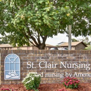 Entrance sign for St. Clair Nursing, surrounded by landscaping and trees.