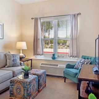 A cozy living room with comfortable seating and tasteful decor.