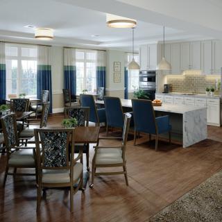 A modern kitchen and dining area with an island counter and elegant seating.