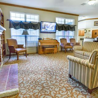 A cozy living room with comfortable seating and a television.