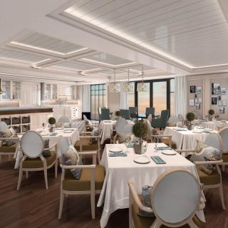 Elegant and modern restaurant dining area with neatly arranged tables and chairs.