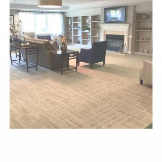 A spacious living room with comfortable seating and a fireplace.