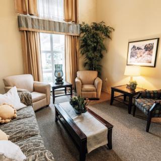 A cozy living room featuring comfortable seating and elegant decor.