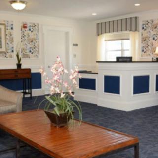 A welcoming hotel reception area with a cozy and elegant design.