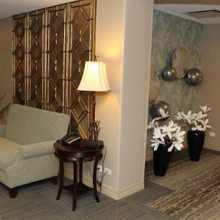 A cozy and elegantly decorated living room corner featuring stylish furniture and decorative elements.
